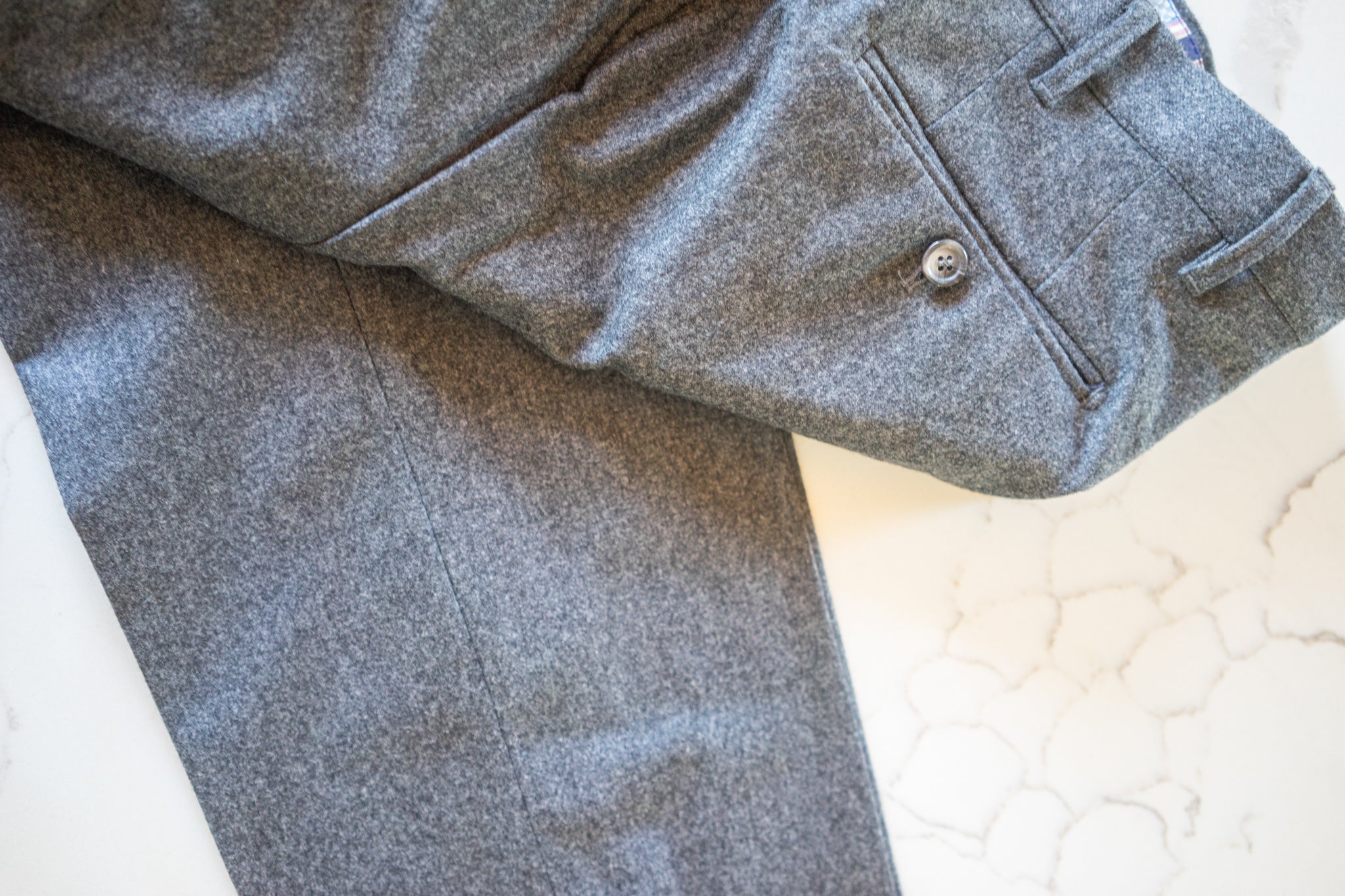 anatoly's grey flannel trousers