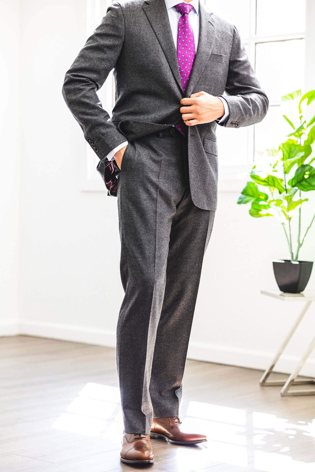 Man wearing Anatoly & Sons Grey Drago "Rugby Flannel" Suit with pink tie